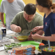 Client with down syndrome partakes in a cooking class